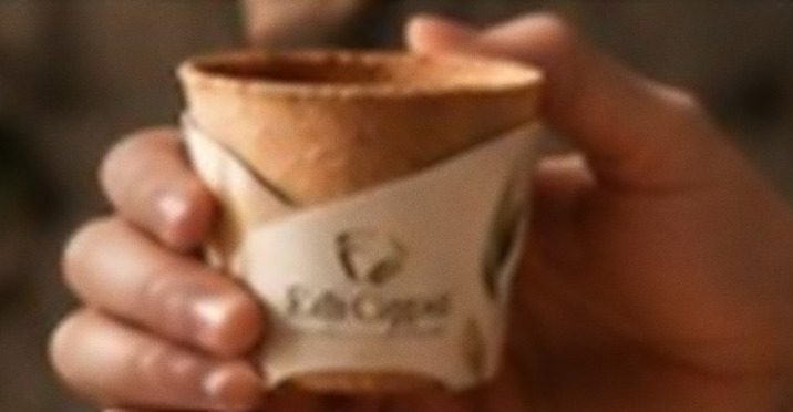 Two hands cradling an Edi Cupia cup.