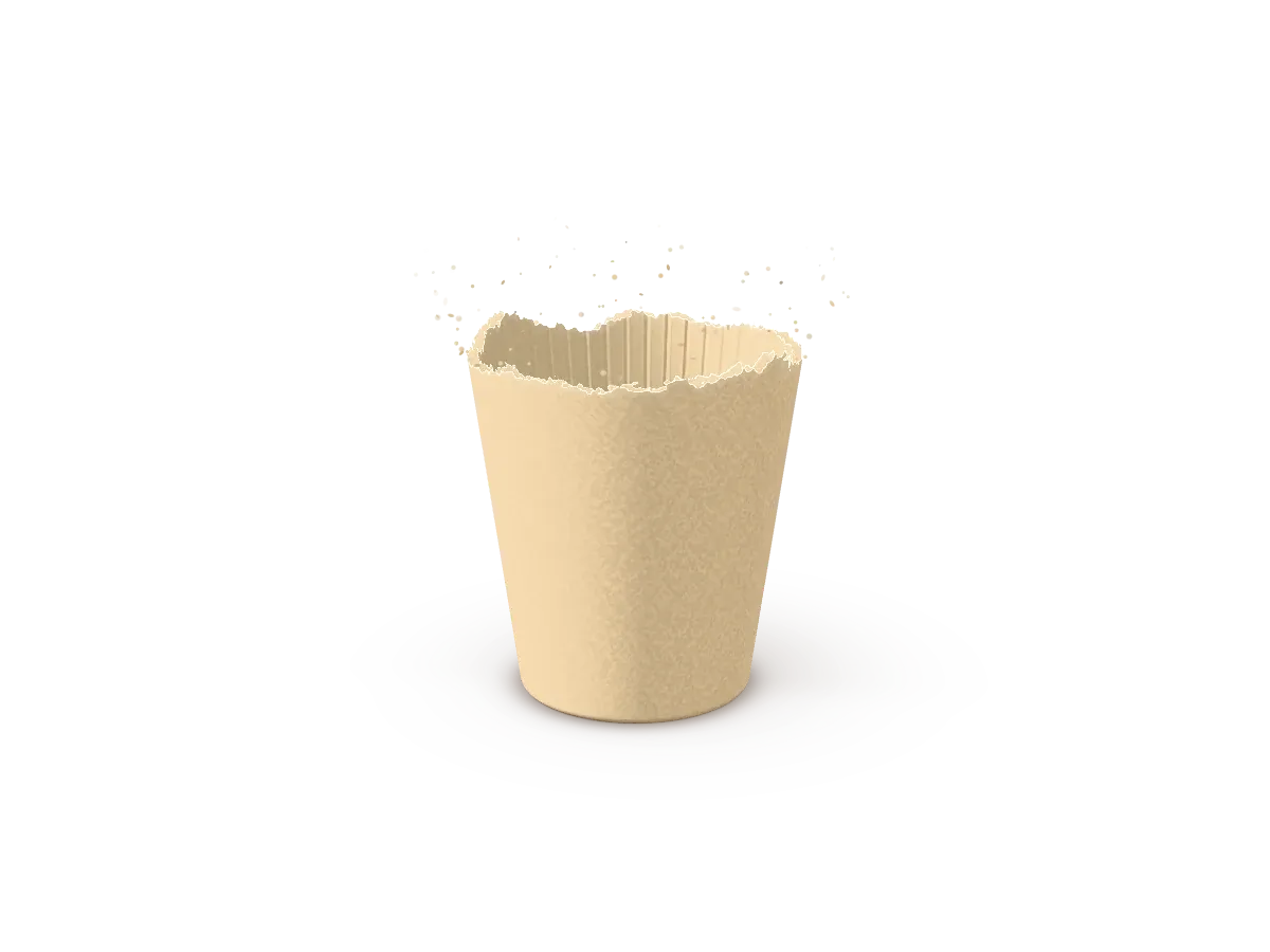 Les particules se rassemblent en une pâte douce et pâle, d’où s’élèvent les parois d’une tasse.